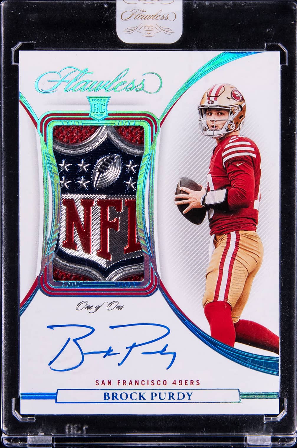 2022 Panini Flawless Rookie Patch Autograph (RPA) Platinum #RPA-BP Brock Purdy Signed NFL Shield Patch Rookie Card (#1/1) - Panini Encased