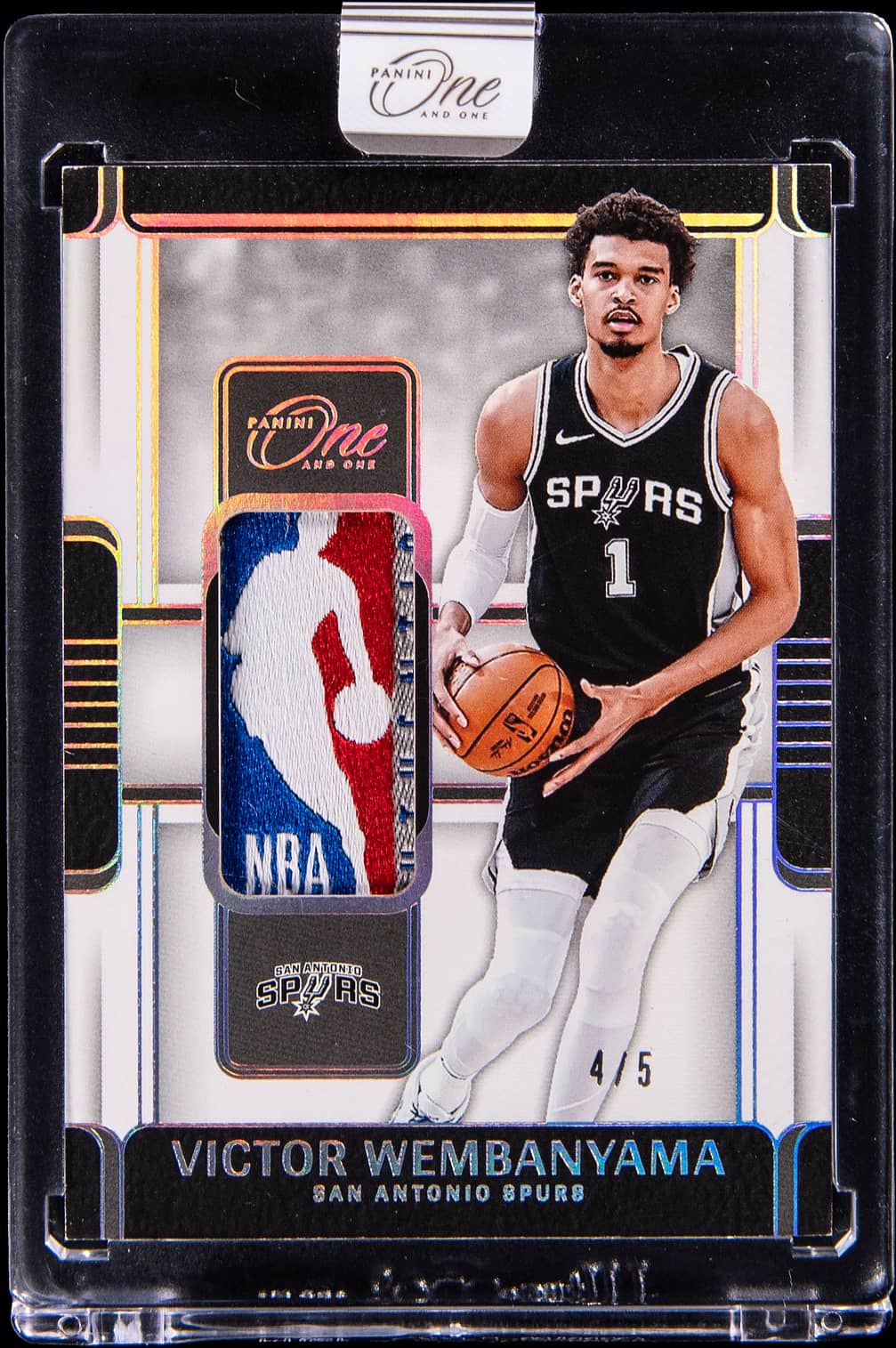 2024-25 Panini One and One Laundry Tag NBA Logo 1st Off the Line (FOTL) White #LTA-WEM Victor Wembanyama Game-Worn/Used Logoman Patch Card (#4/5) - Panini Encased